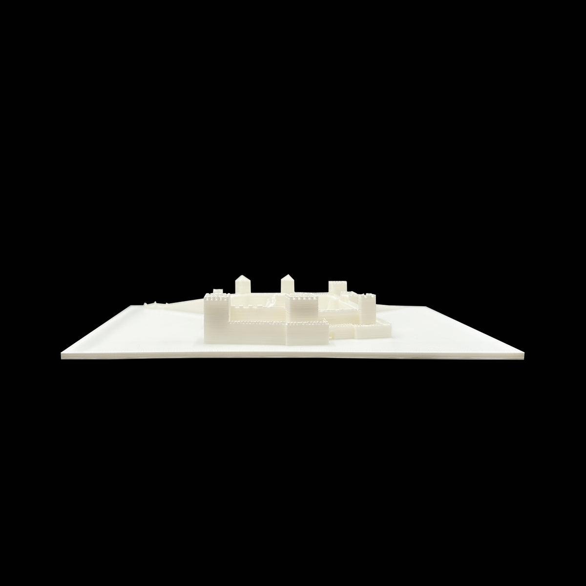 A white 3D model of a building or structure is displayed against a black background.