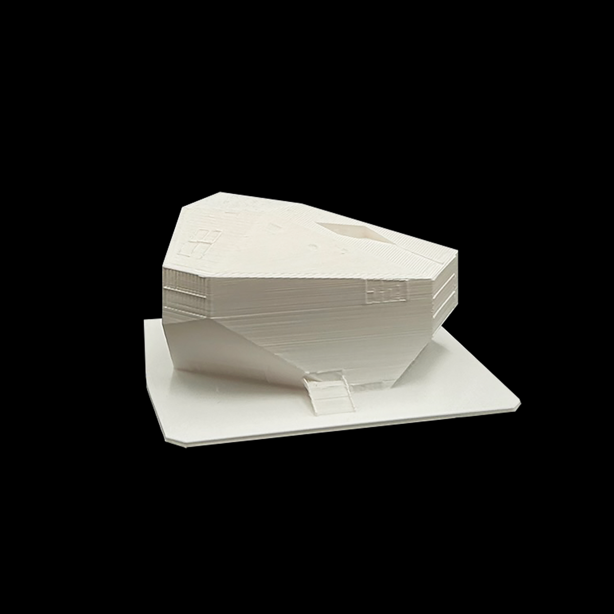 A white 3D model of a building or structure is shown against a black background.