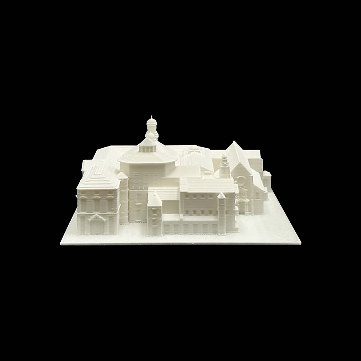 A white 3D model of a building with a dome and multiple towers, set against a black background.