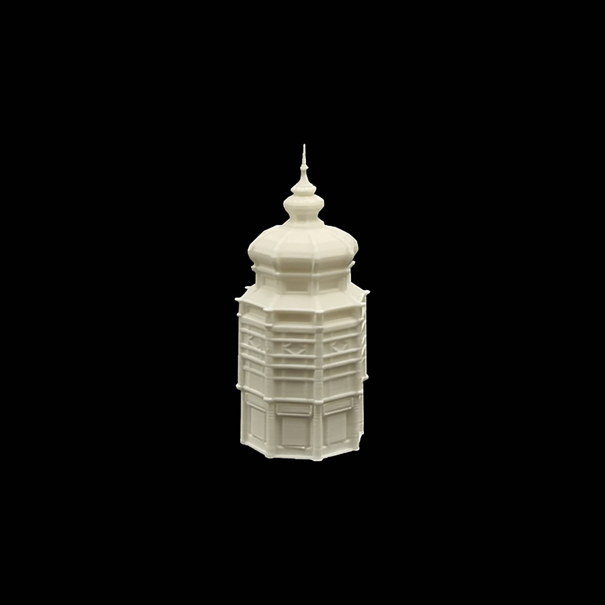 A white, three-dimensional model of a building with a pointed roof and a small spire, set against a black background.