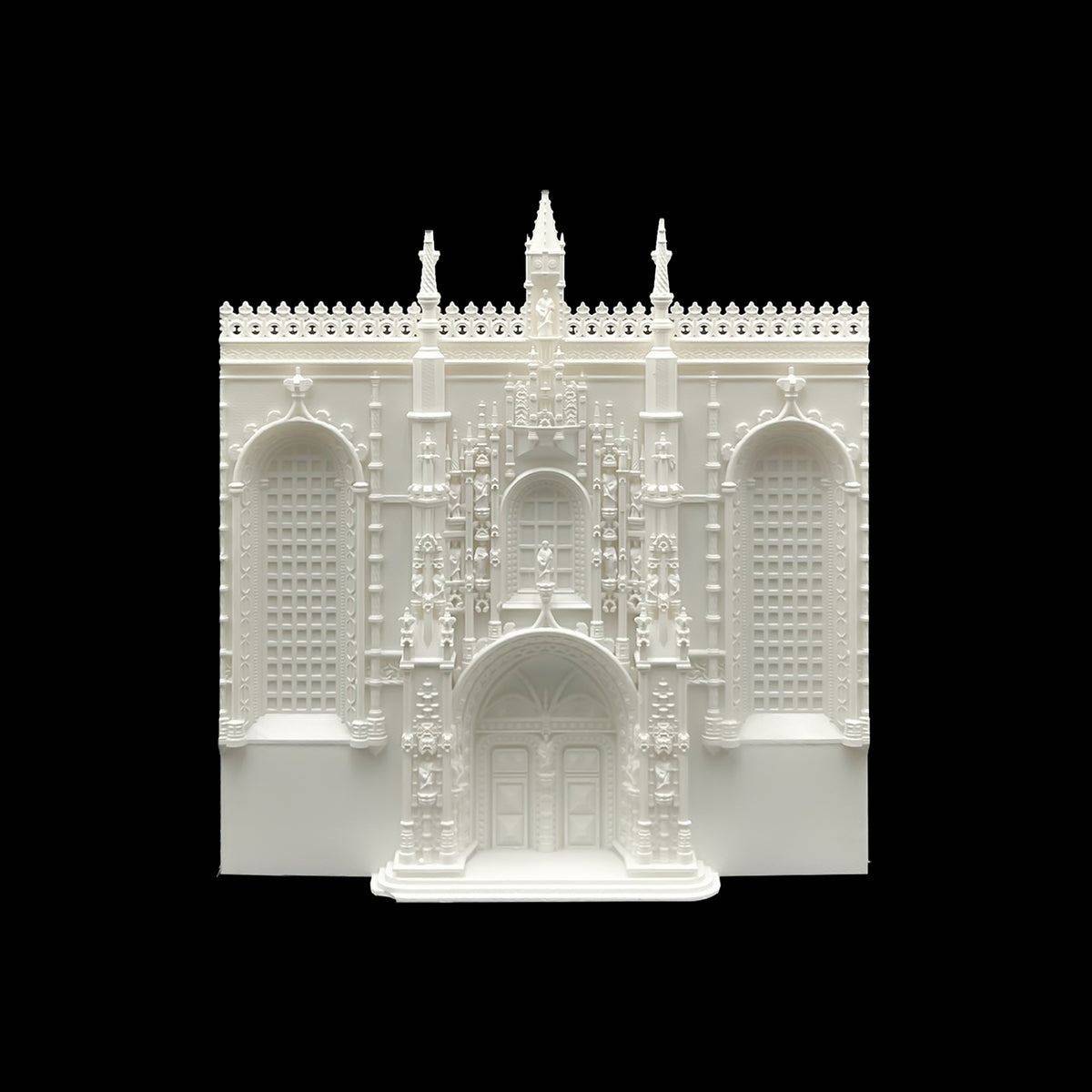 A white, ornate, and intricate 3D model of a building, possibly a historical or architectural structure, against a black background.