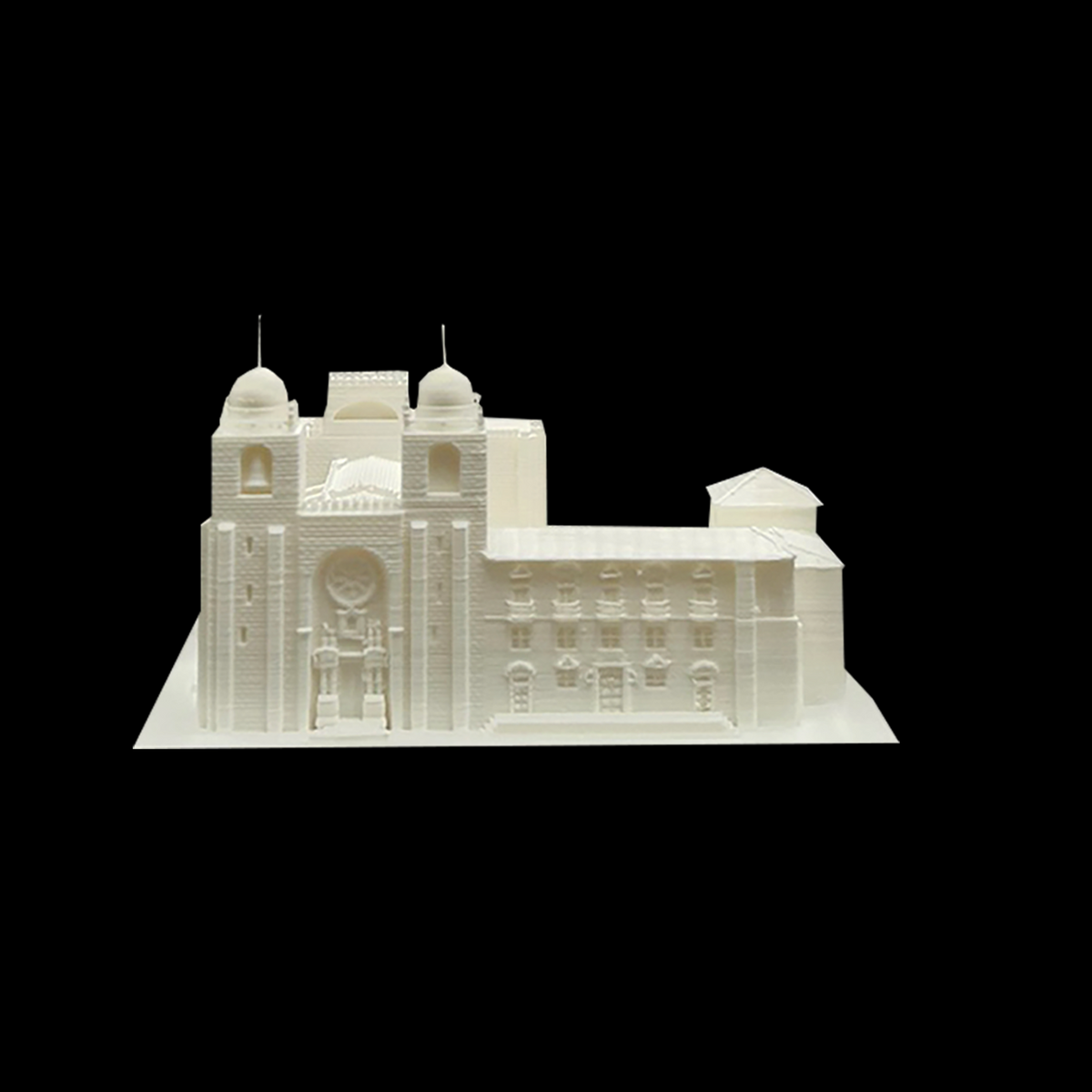 A 3D model of a building with a dome and two towers, displayed against a black background.