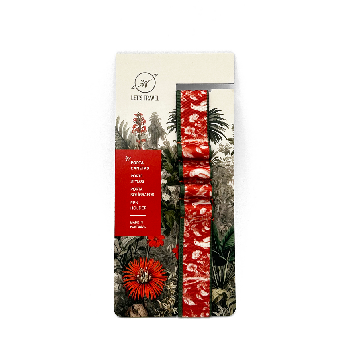 a package with a tropical print design, including a red and white patterned ribbon and a red flower. The package appears to be a travel-related product, as indicated by the text "Let's travel" and "Porta Canetas".