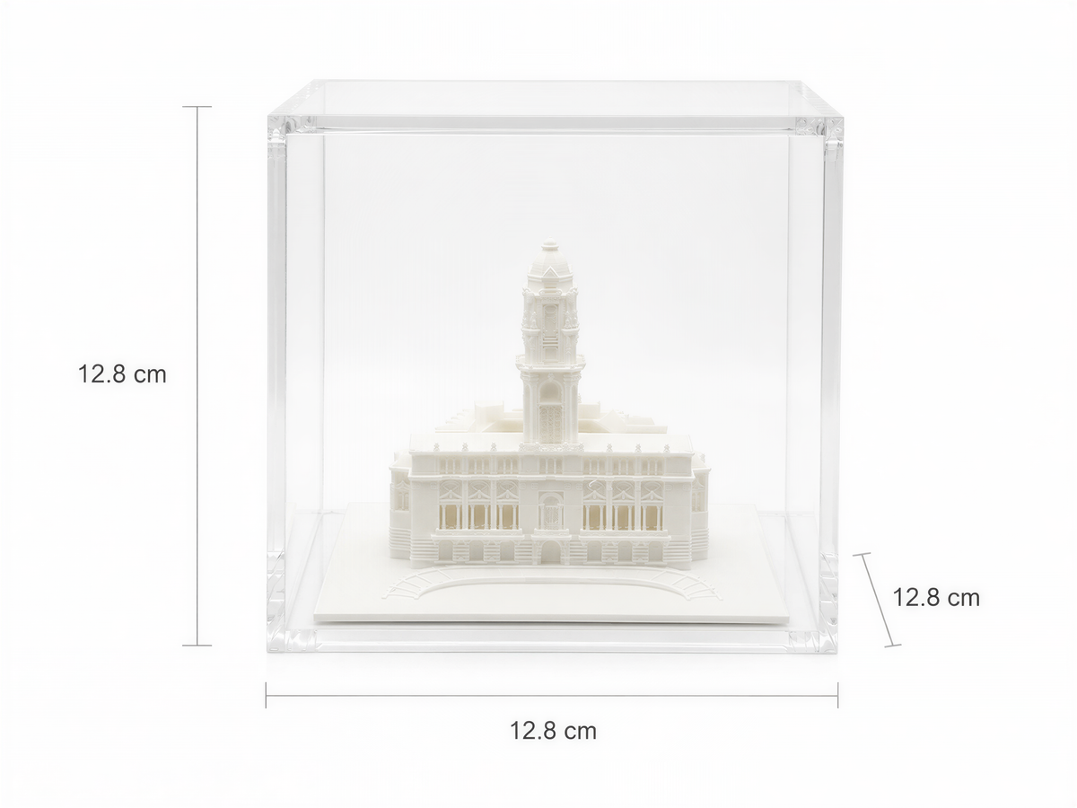 A miniature model of a building, likely a historical or architectural landmark, displayed in a clear glass case.