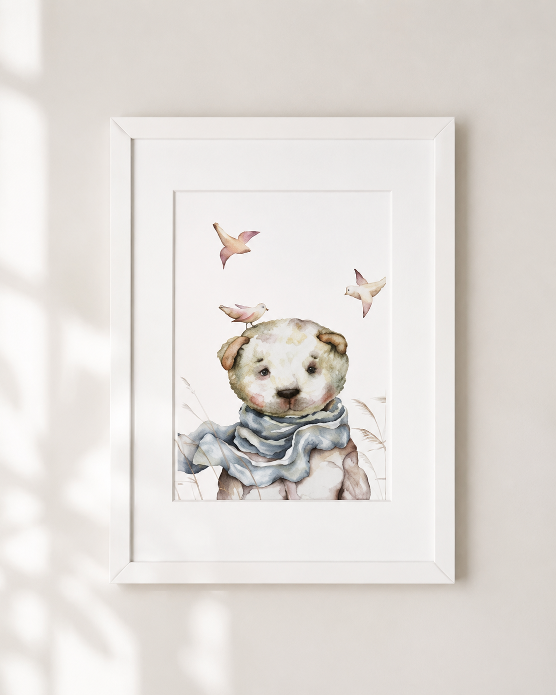 A framed watercolor painting depicting a teddy bear wearing a scarf, with birds flying around it.