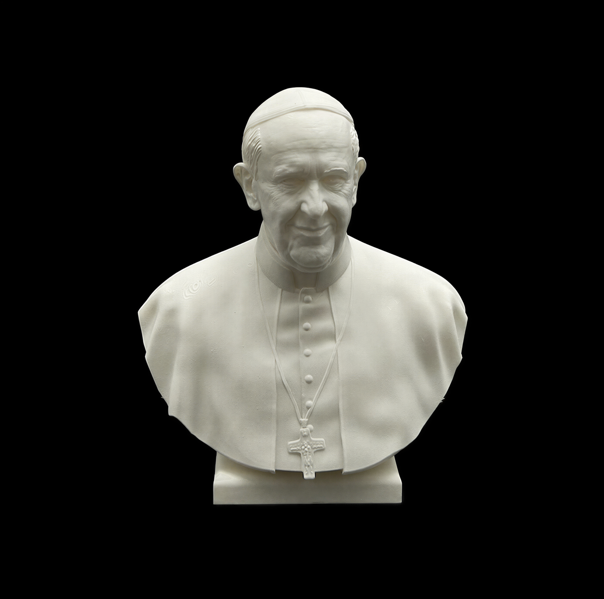 A white bust of a man wearing a religious collar, likely representing a religious leader.