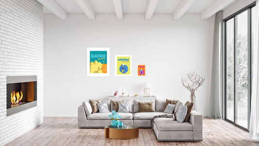A modern living room with a fireplace, a large sectional sofa, and artwork on the walls.