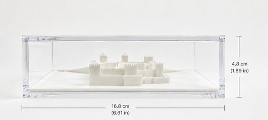 A 3D model of a castle or fortress displayed in a clear plastic case, with dimensions provided.