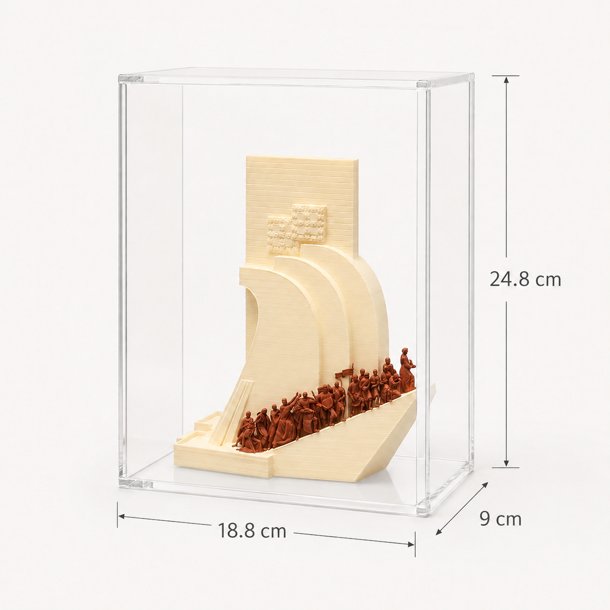 a small sculpture of a ship, displayed in a clear glass case.