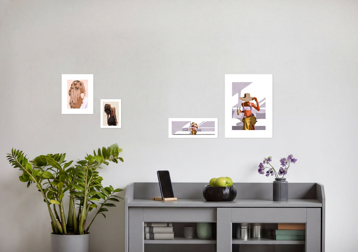 a gray cabinet with various items on top, including a potted plant, a vase with purple flowers, and a smartphone. There are also several framed pictures or prints displayed on the wall above the cabinet.